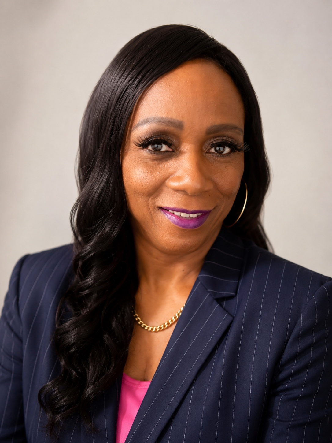 Dr. Gloria Simons in a navy blazer